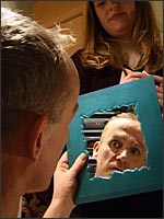 photo of Garry looking in mirror